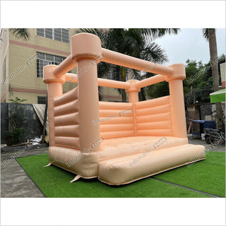 Pastel Peach Wedding Bounce House Castle